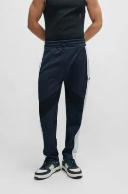 Relaxed-fit tracksuit bottoms with color-blocking