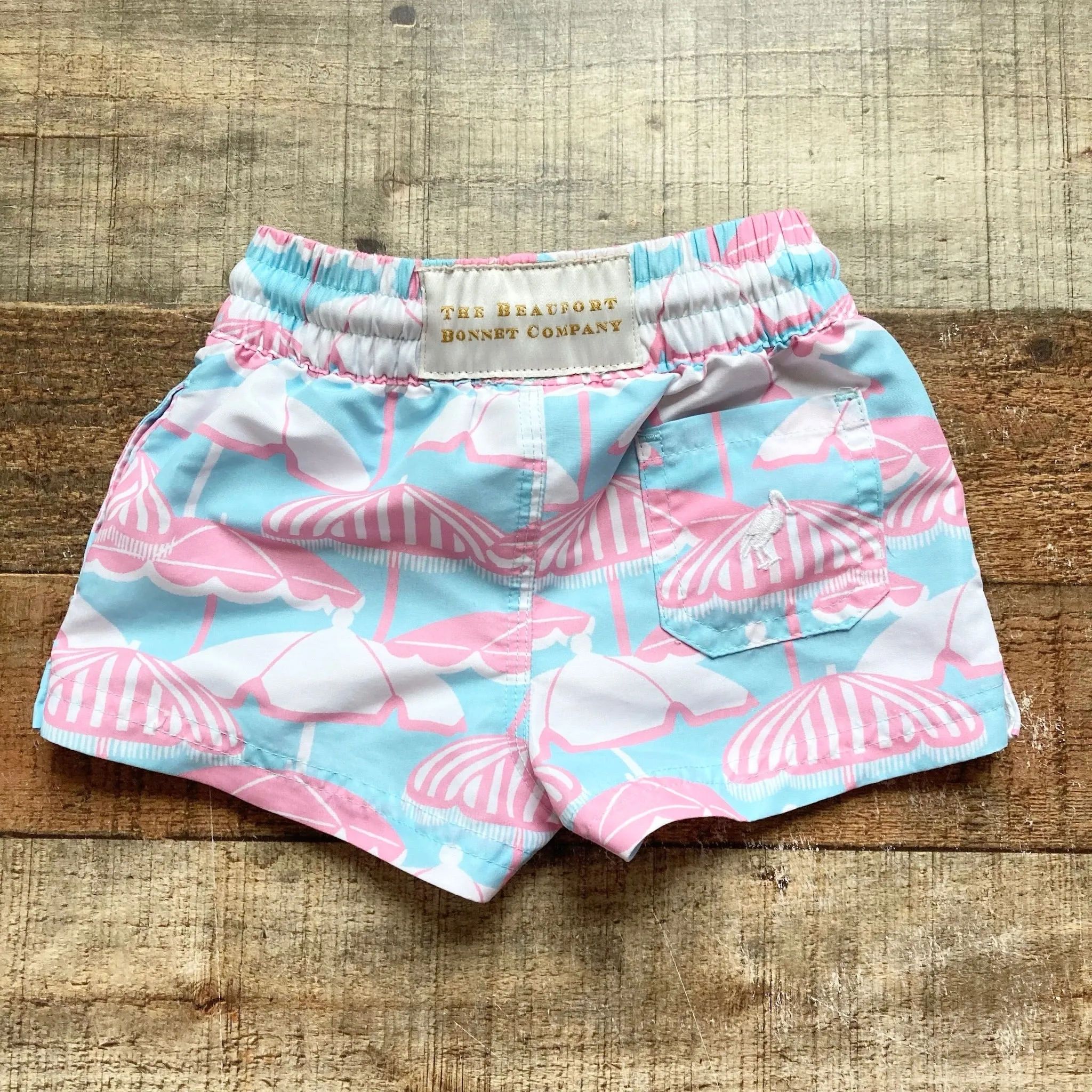 The Beaufort Bonnet Company Light Blue/Pink Beach Umbrella Swim Trunks- Size 6-12M